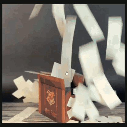 Acceptance letters fly out of the open suitcase-style gift box.